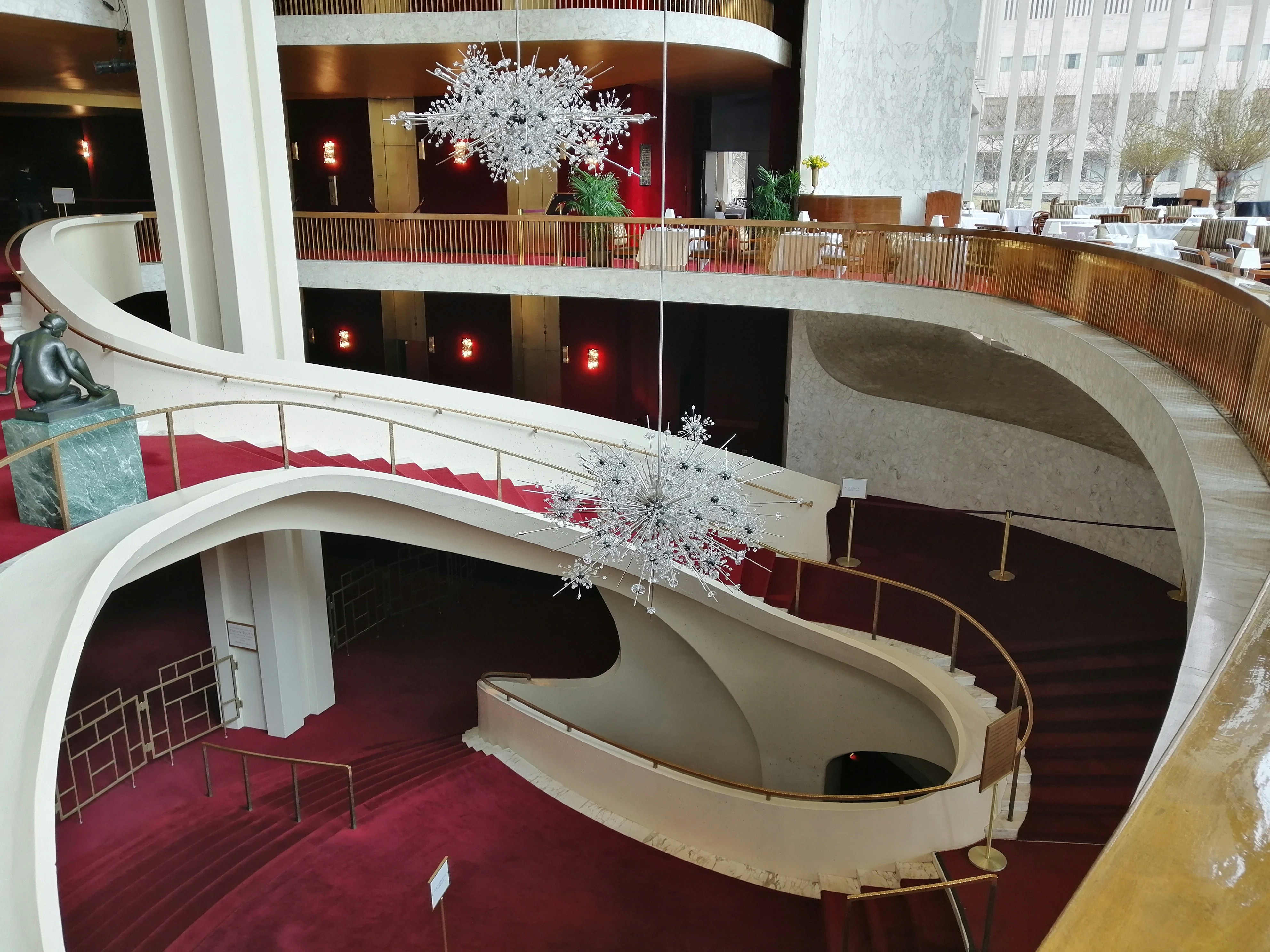 Chandeliers and staircases inside the Metropolitan Opera House — Christina Grohowski’s Lindemann program announcement