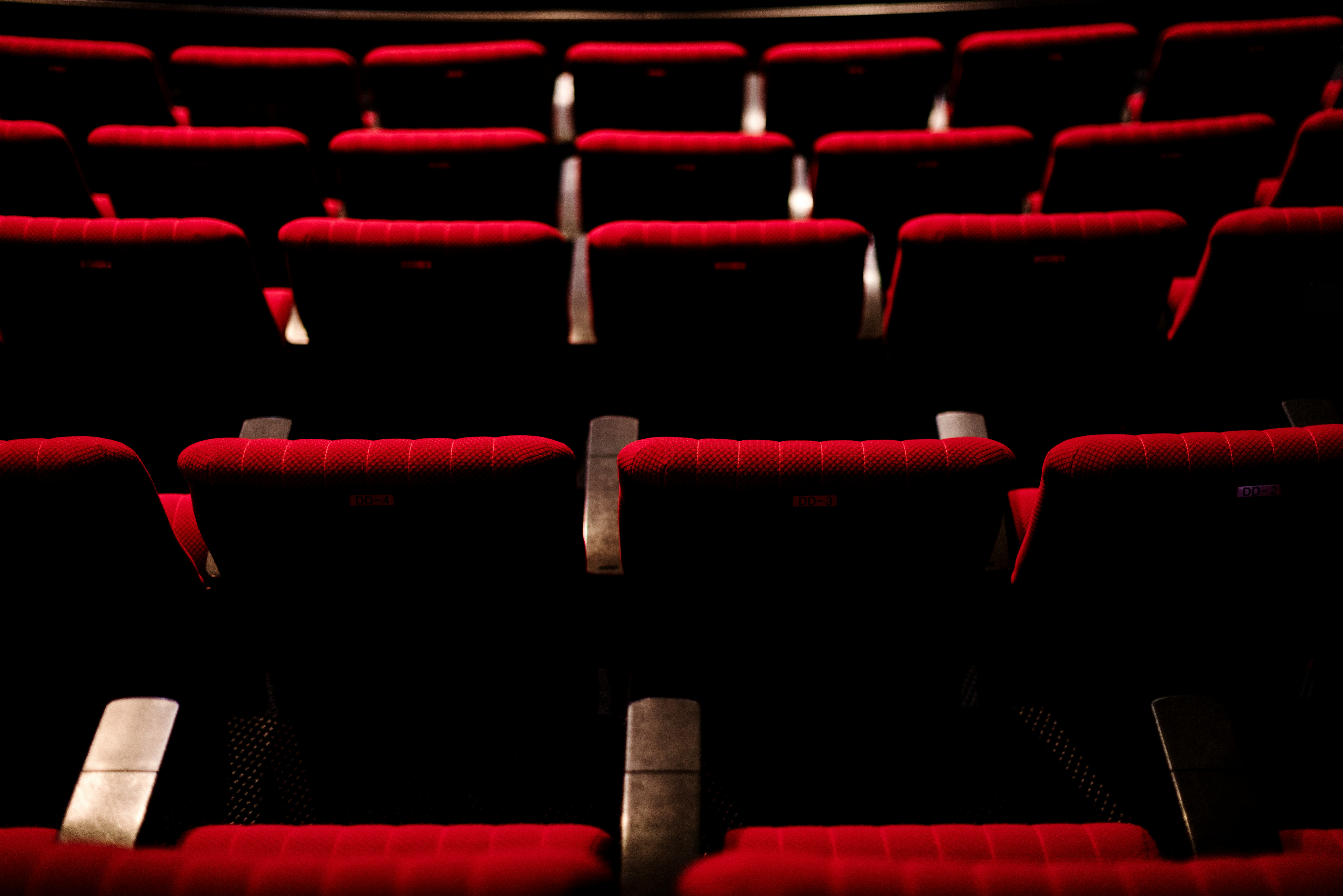 Rows of red theater seats.